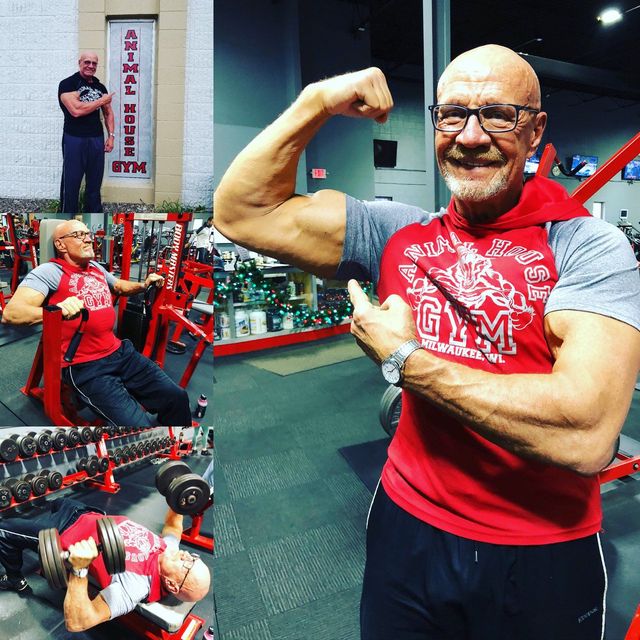 A man wearing a red shirt that says gym on it