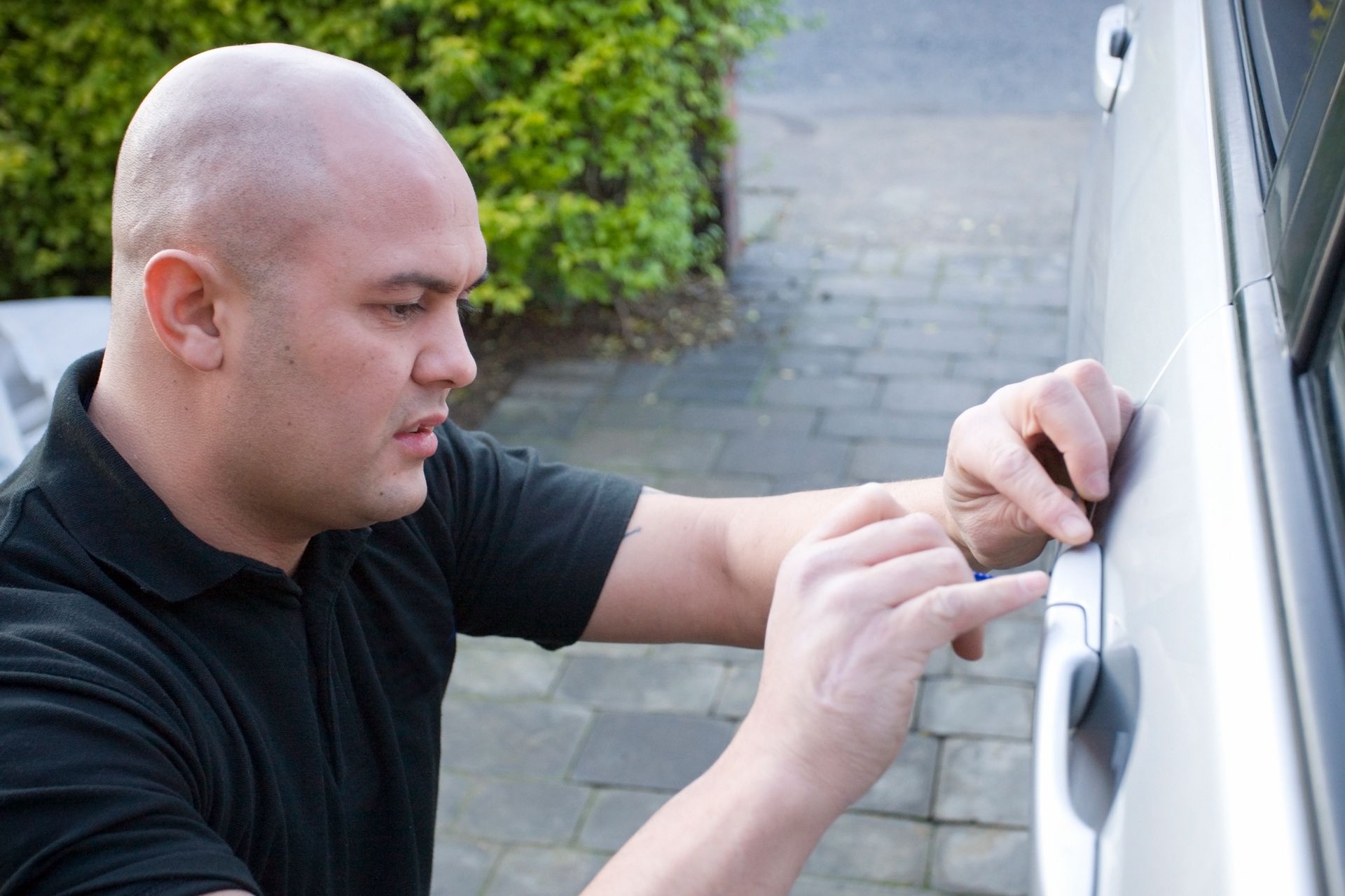 Professional locksmith unlocking a car in a car lockout situation, providing emergency services | American Fork, UT Professional locksmith unlocking a car in a car lockout situation, providing emergency services | American Fork, UT