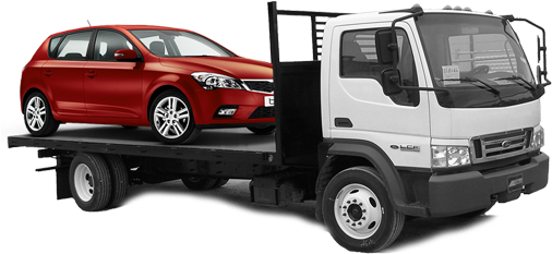 Towing a red car in a white truck