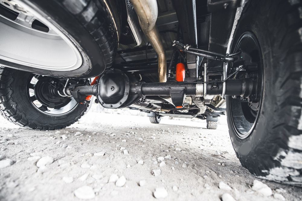 A Close Up of the Underside of a Truck on a Dirt Road — Westlakes 4x4 Centre in Maitland, NSW