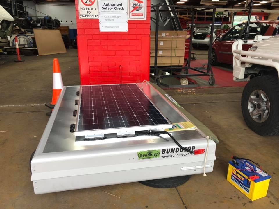 A Solar Panel is Sitting on Top of a Trailer in a Garage — Westlakes 4x4 Centre in Maitland, NSW