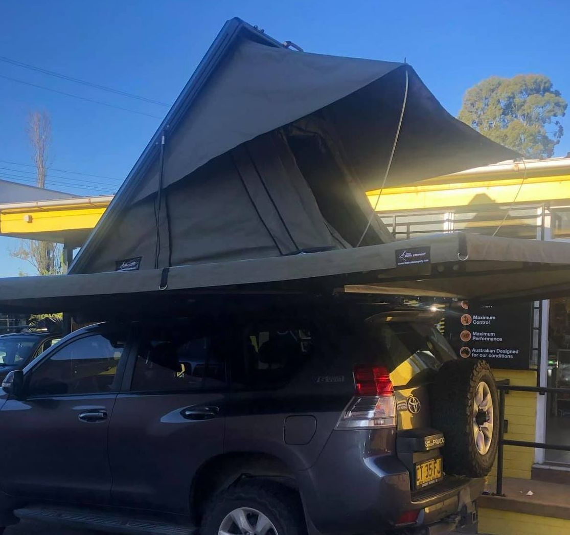 A Gray Suv With a Tent on Top of It — Westlakes 4x4 Centre in Maitland, NSW