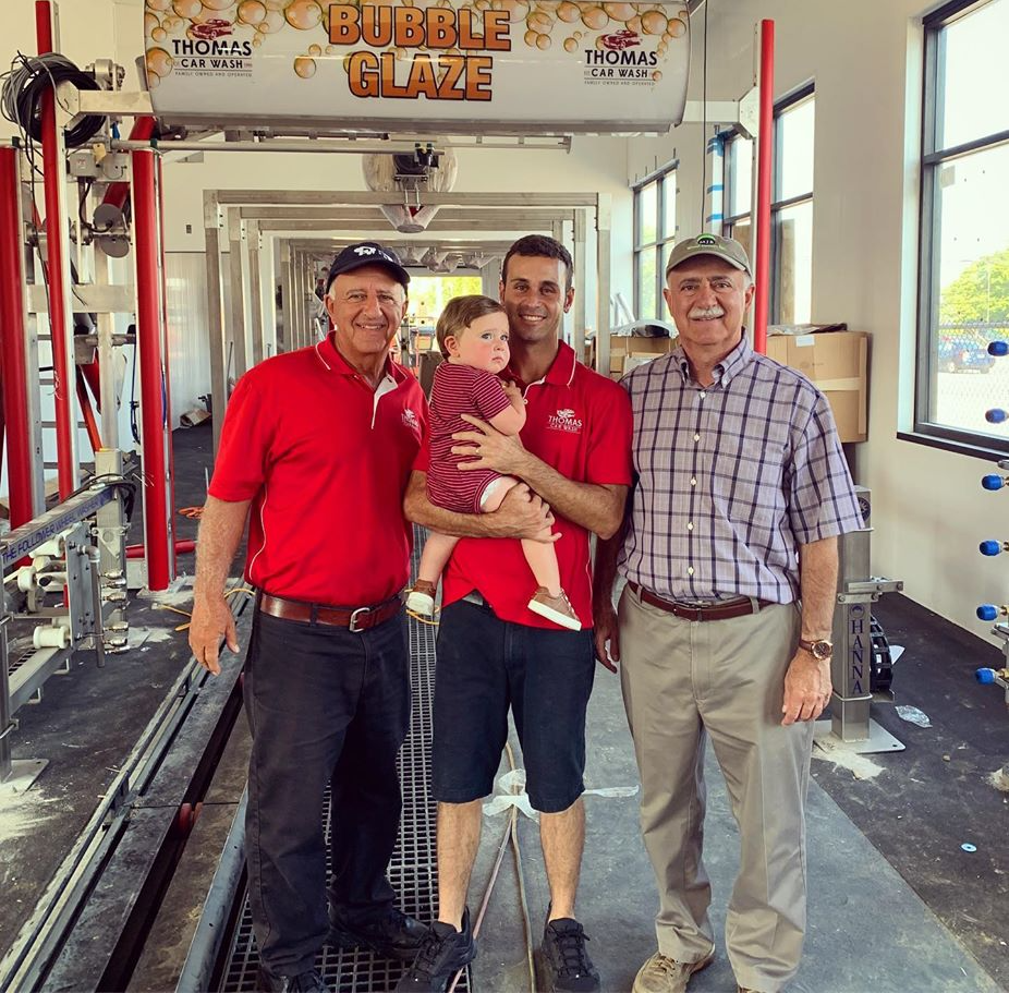 Four members of the Thomas family in a car wash tunnel. Thomas legacy.