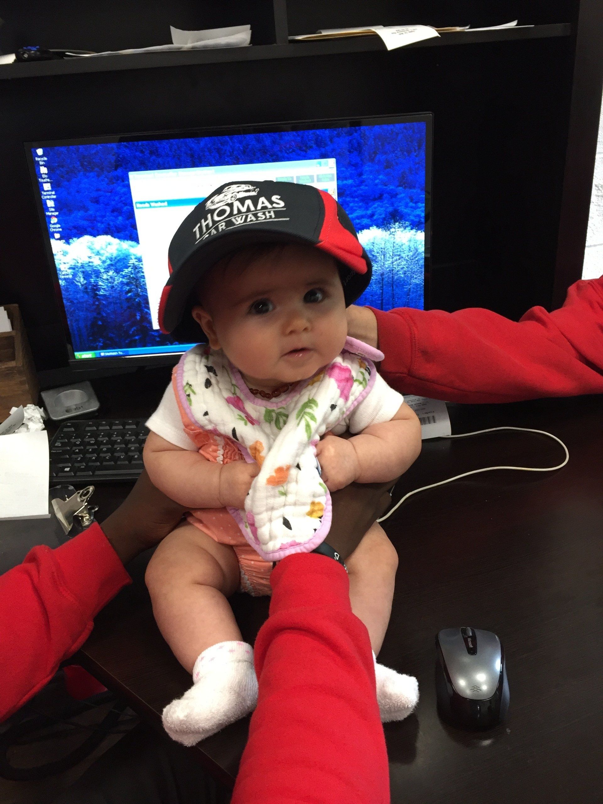 Adorable baby Molly wearing a Thomas Car Wash hat.