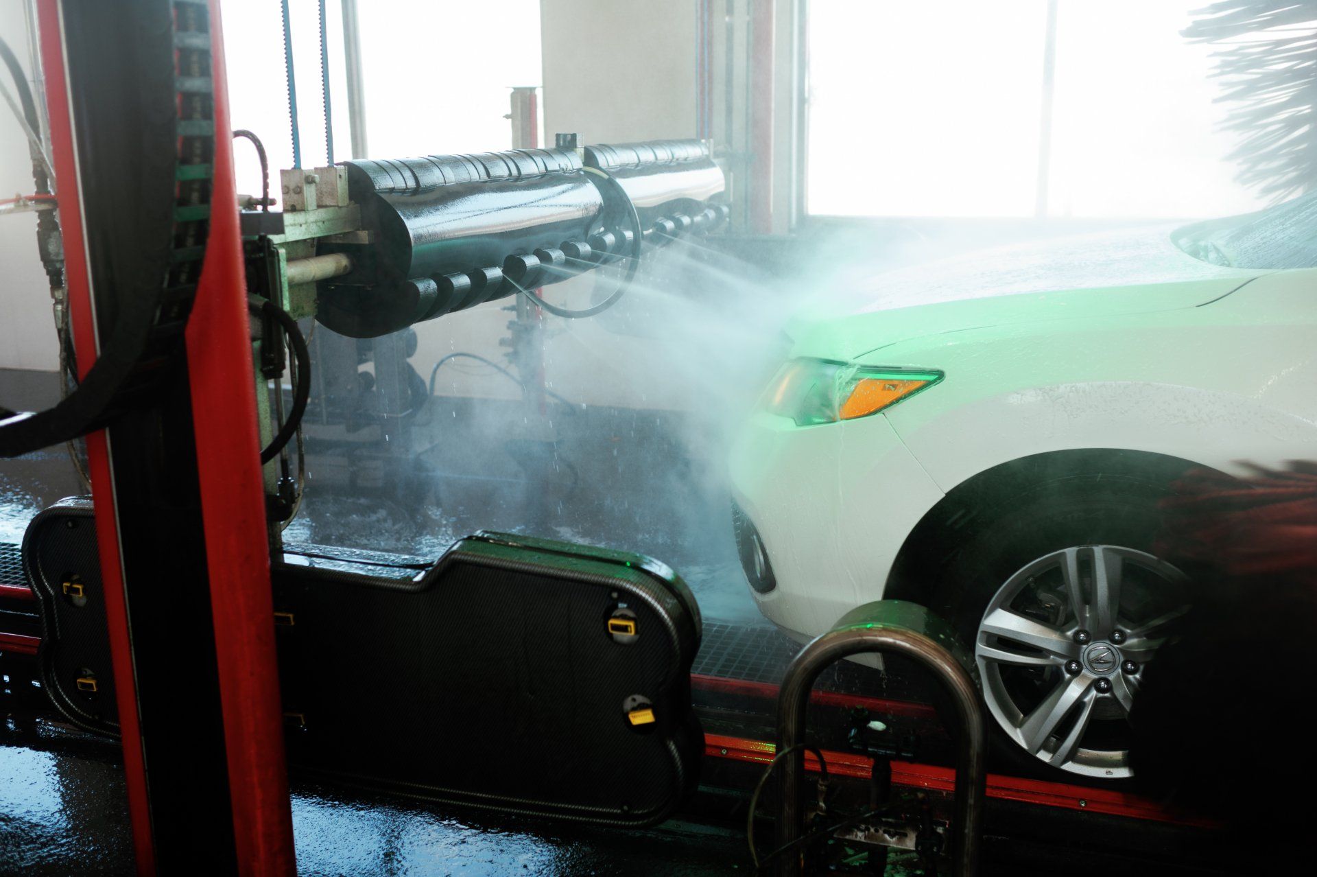 car going through an express tunnel car wash
