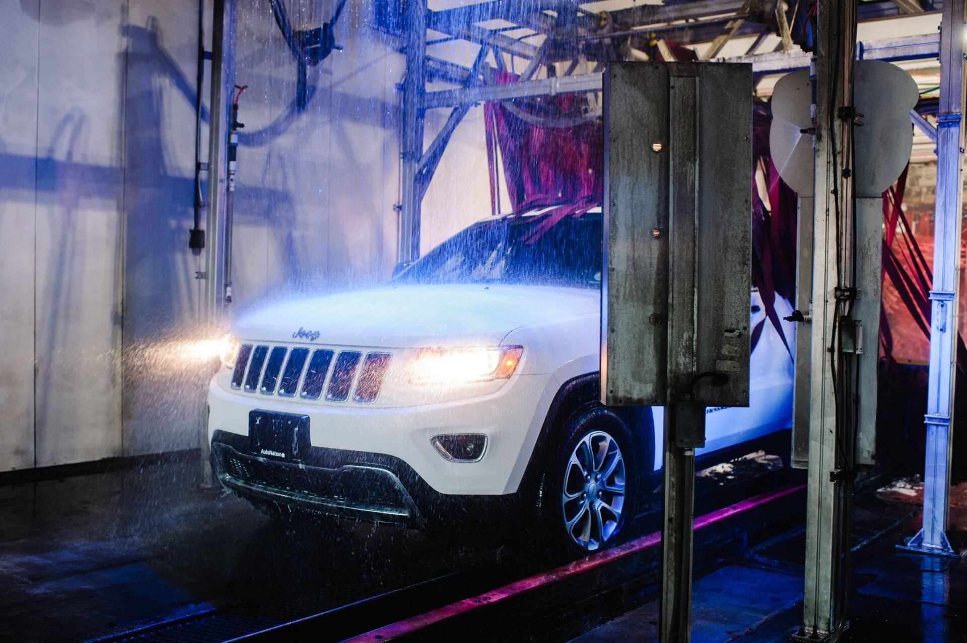 White jeep going through the car wash tunnel, Preston location
