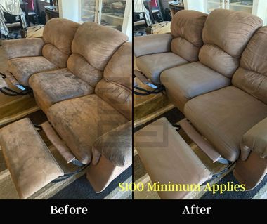 Cleaner vacuuming a beige sofa in a bright living room with a handheld upholstery tool