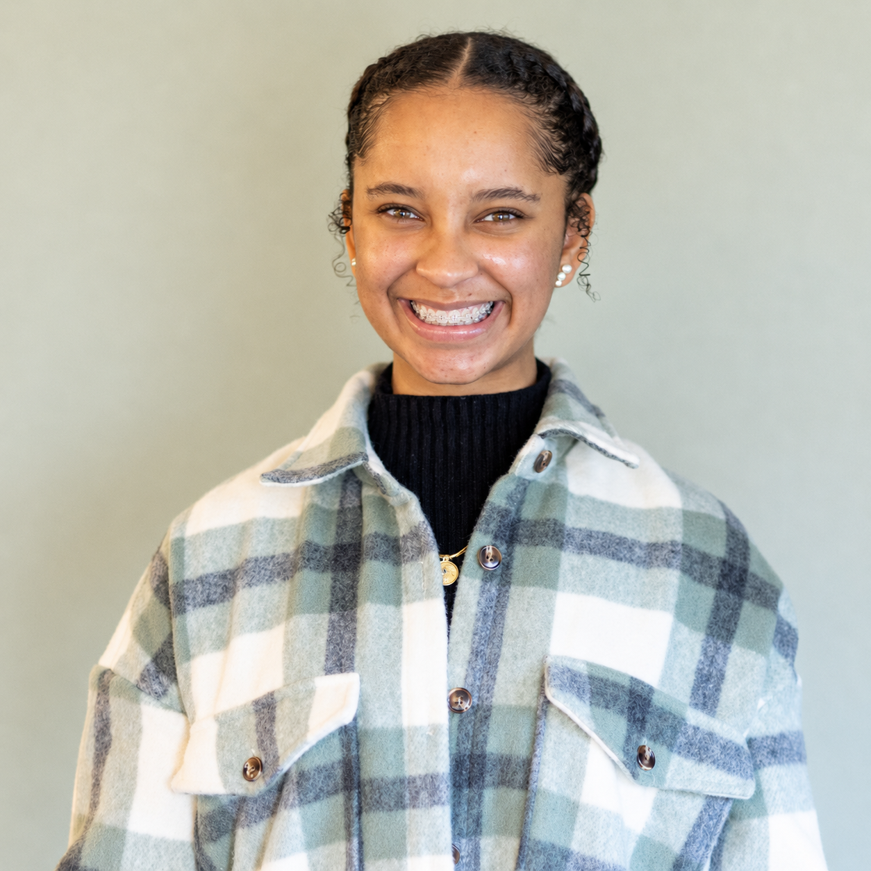 Smiling teen wearing clear ceramic braces from Brodsky Orthodontics in Lakewood, California