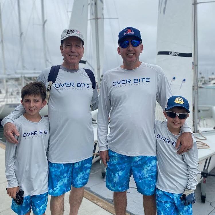 Dr. Joel Brodsky with his son, Dr. Charles Brodsky, and two grandsons at a marina