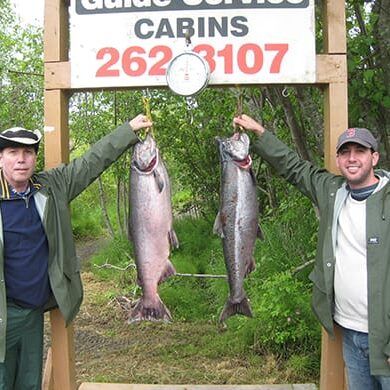 Dr. Joel Brodsky holding a large fish during a trip outside the orthodontic office