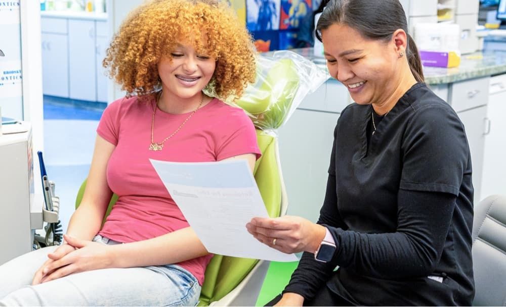 Brodsky Orthodontics team member with a patient