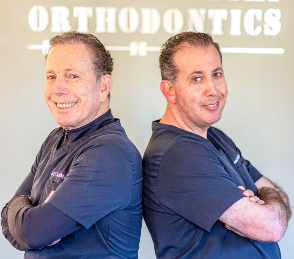 Two side-by-side portraits of a smiling person in a dark shirt with arms crossed, under an “ORTHODONTICS” sign