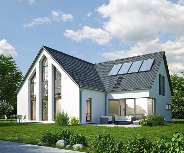 white home with pitched roof and solar panels