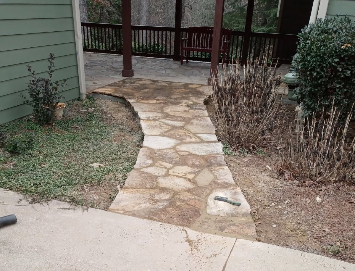A path leading to a house in the woods