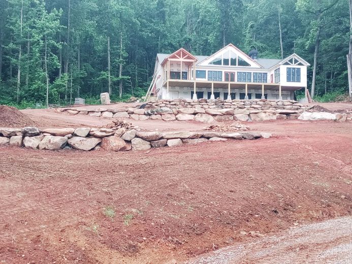 A large house is being built in the middle of a forest
