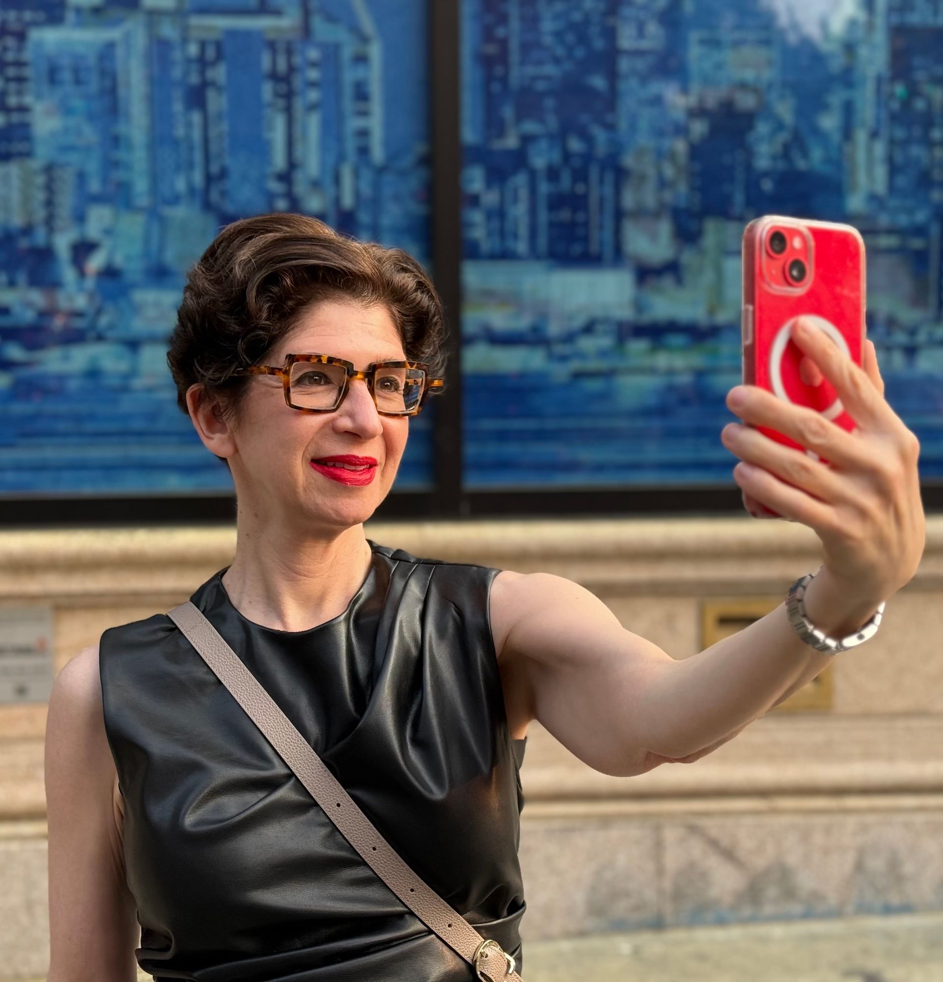 Slut-shaming expert and author Leora Tanenbaum taking a selfie with her  phone.