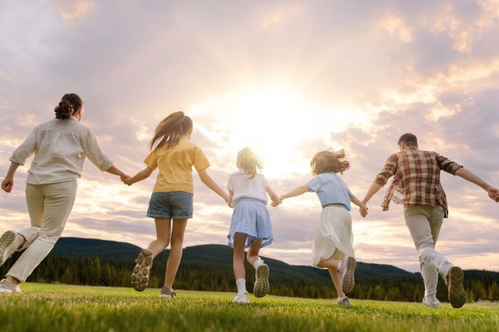 Family running through field