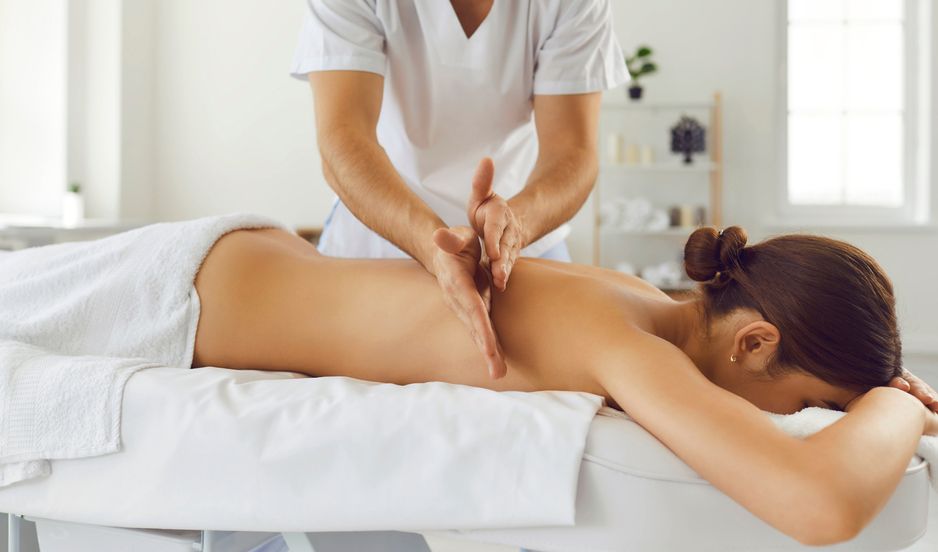 A woman is getting a massage at a spa.
