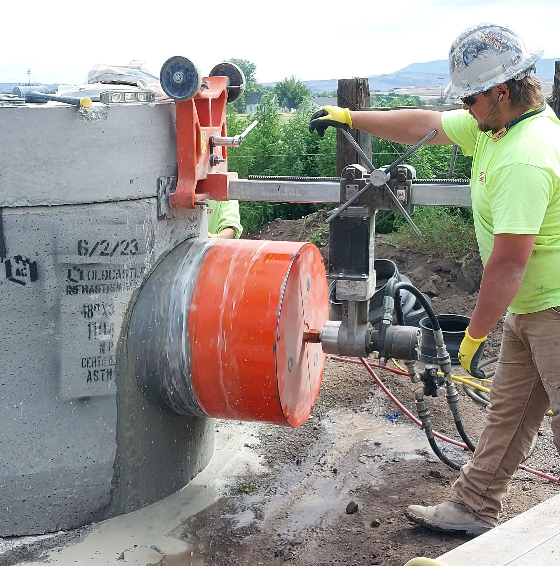 Worker Using Cutting Machine and Cutting Concrete — Caldwell, ID — ACDS Concrete Cutting Worker Using Cutting Machine and Cutting Concrete — Caldwell, ID — ACDS Concrete Cutting