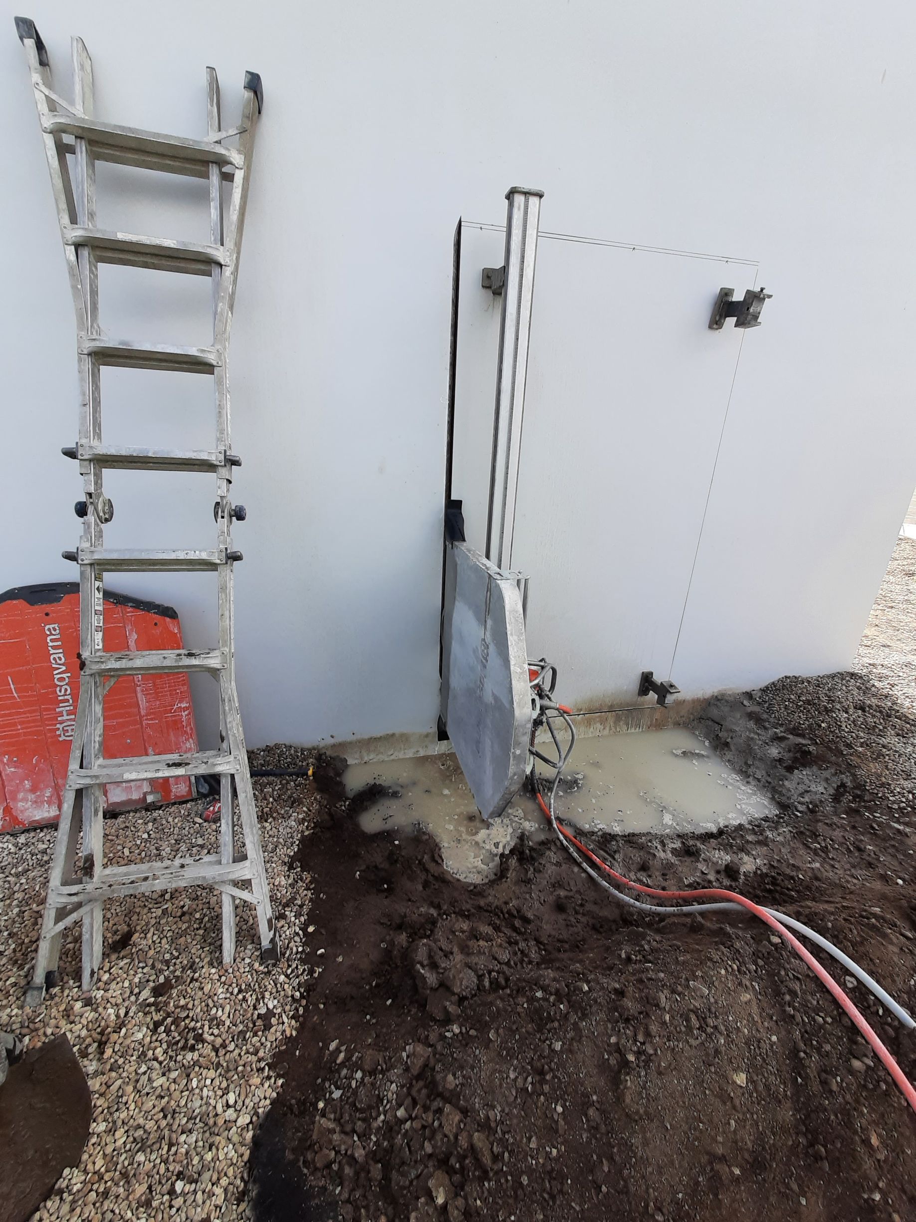 Ladder Is Sitting Next To A Machine — Caldwell, ID — ACDS Concrete Cutting