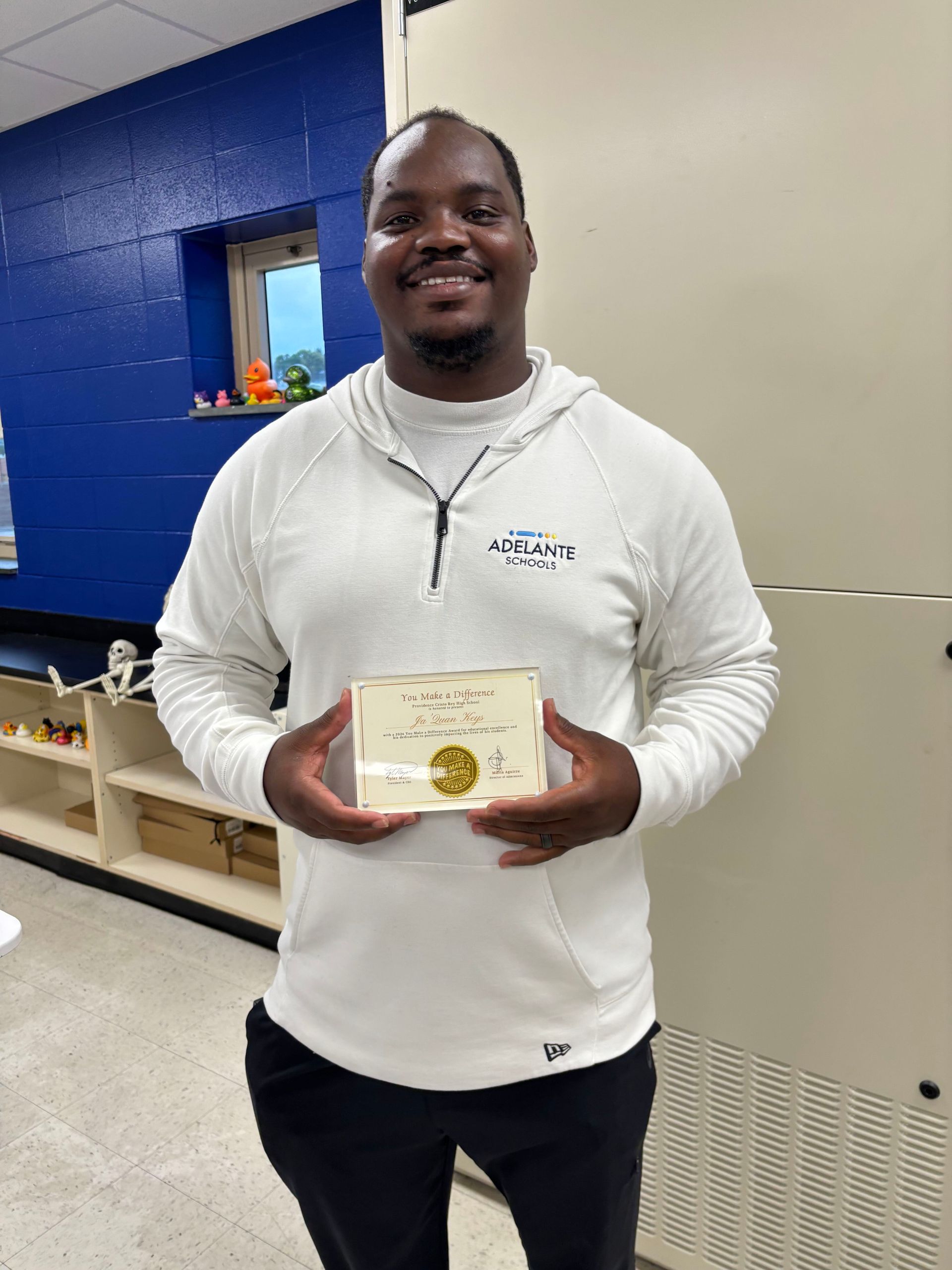 Mr. Keys, Middle School Science teacher, being recognized by a former student