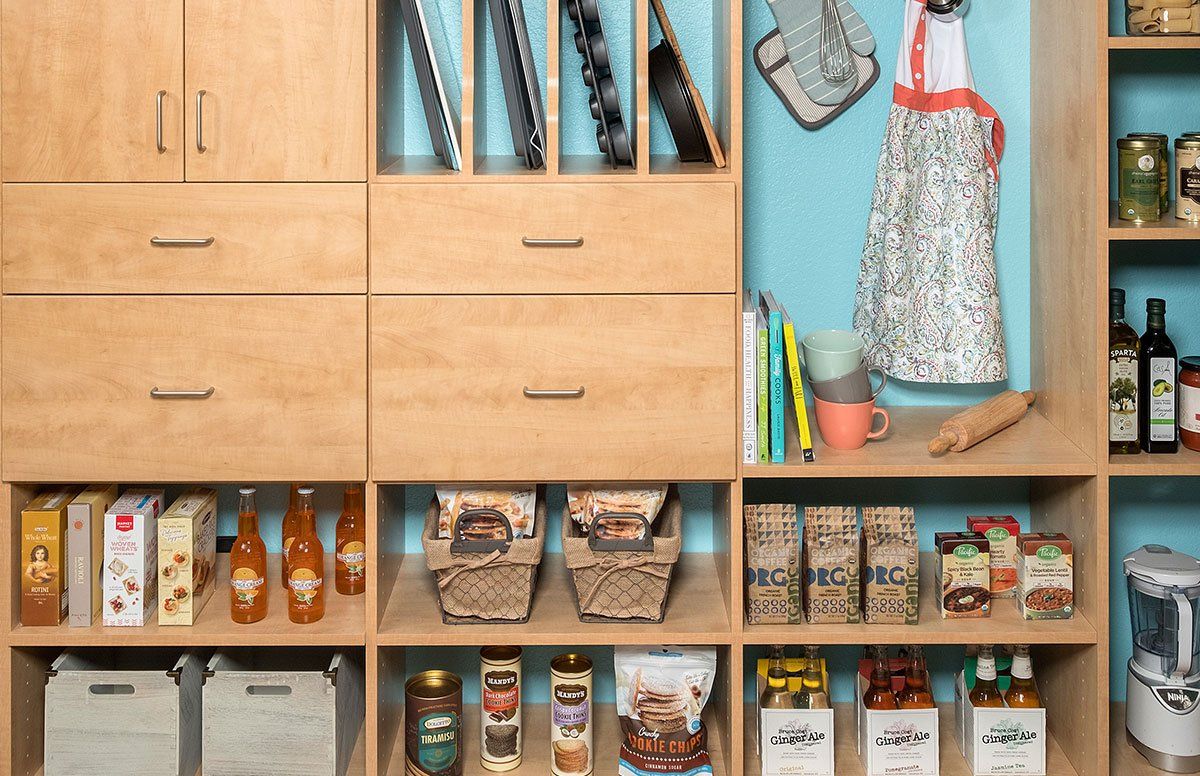 A pantry filled with lots of food and bottles