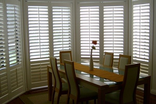 Basswood Timber Plantation Shutters In Dining Room — Wholesale Window Coverings in Port Stephens, NSW