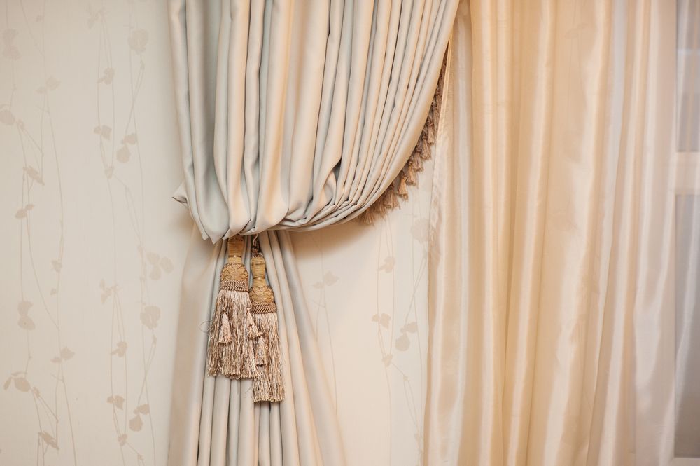 A Close-Up of a Curtain With Tassels on It — Window Coverings in Cardiff, NSW