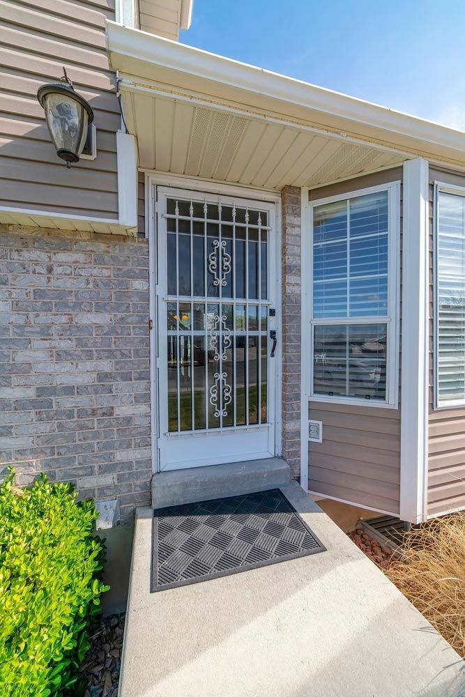Entrance Of A House With Glass Front Door — Wholesale Window Coverings in Lake Macquarie, NSW