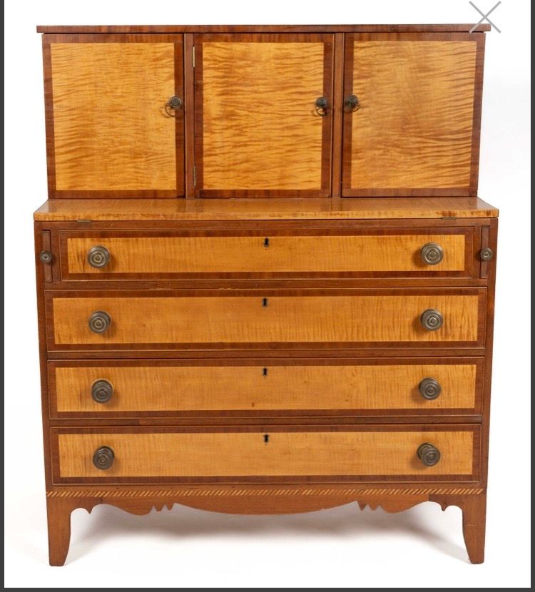 Vintage wooden cabinet with woven doors on top and four drawers below, shown front view