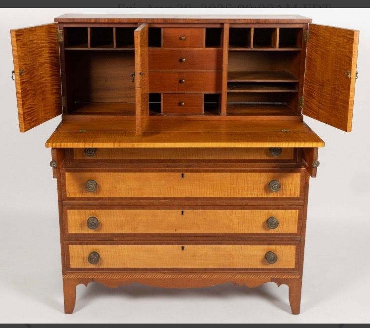 Open wooden secretary desk with drawers and cabinet doors, front view on a white background
