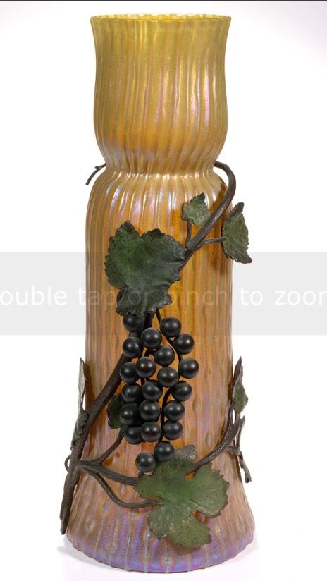 Decorative amber glass vase with grapevine and dark purple grape cluster ornament