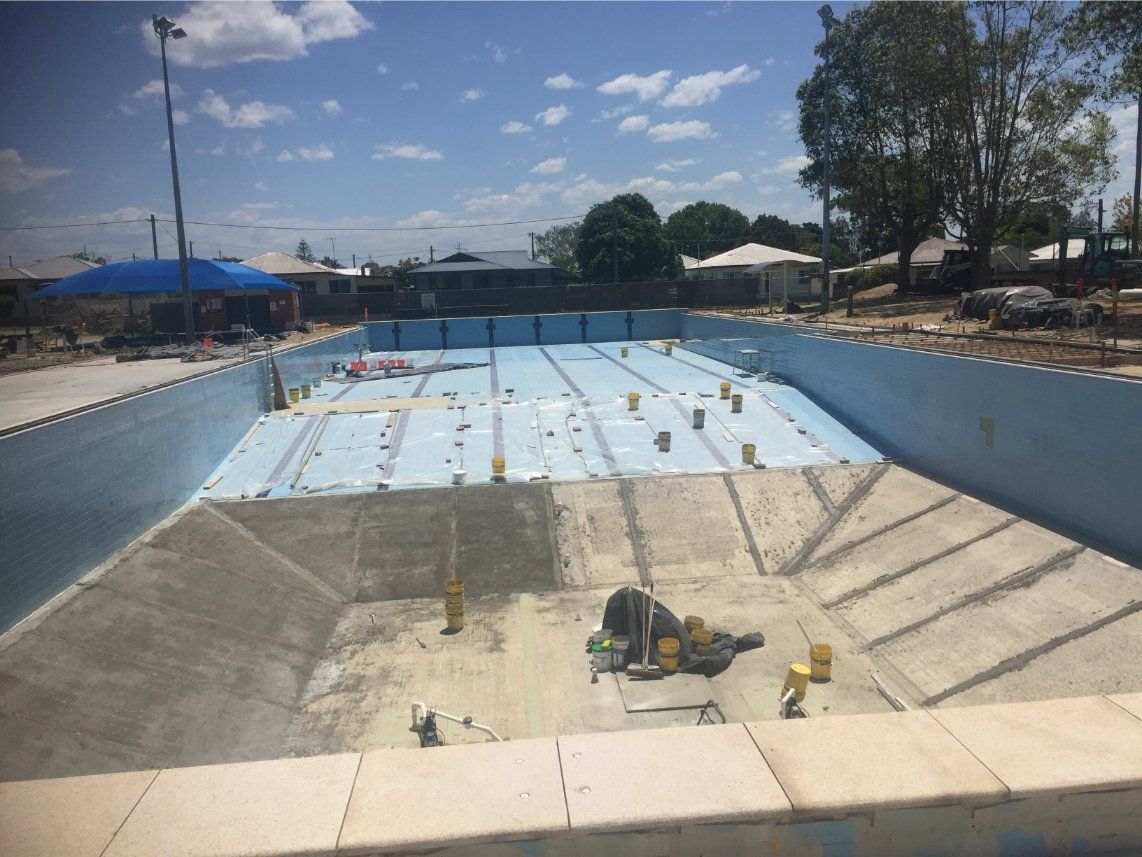 Construction of an Empty Blue Swimming Pool — Worrall Tiling in South West Rocks, NSW