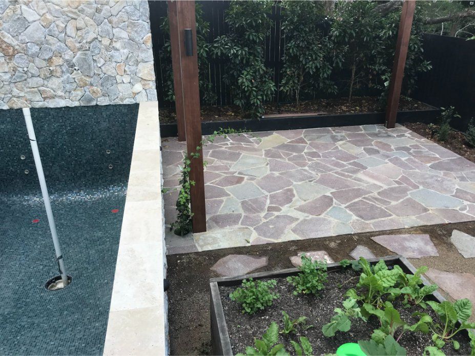 Stone patio with a garden. — Worrall Tiling in South Kempsey, NSW