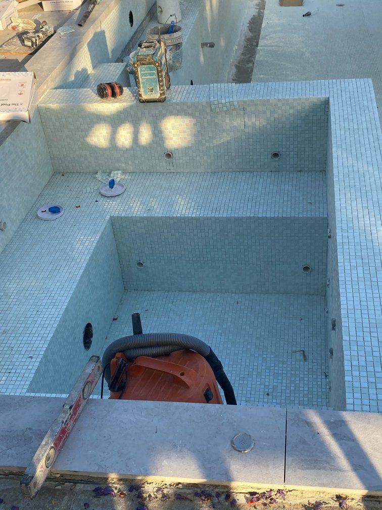 Pool With Tiled Interior, Water Features, and Tools — Worrall Tiling in Crescent Head, NSW