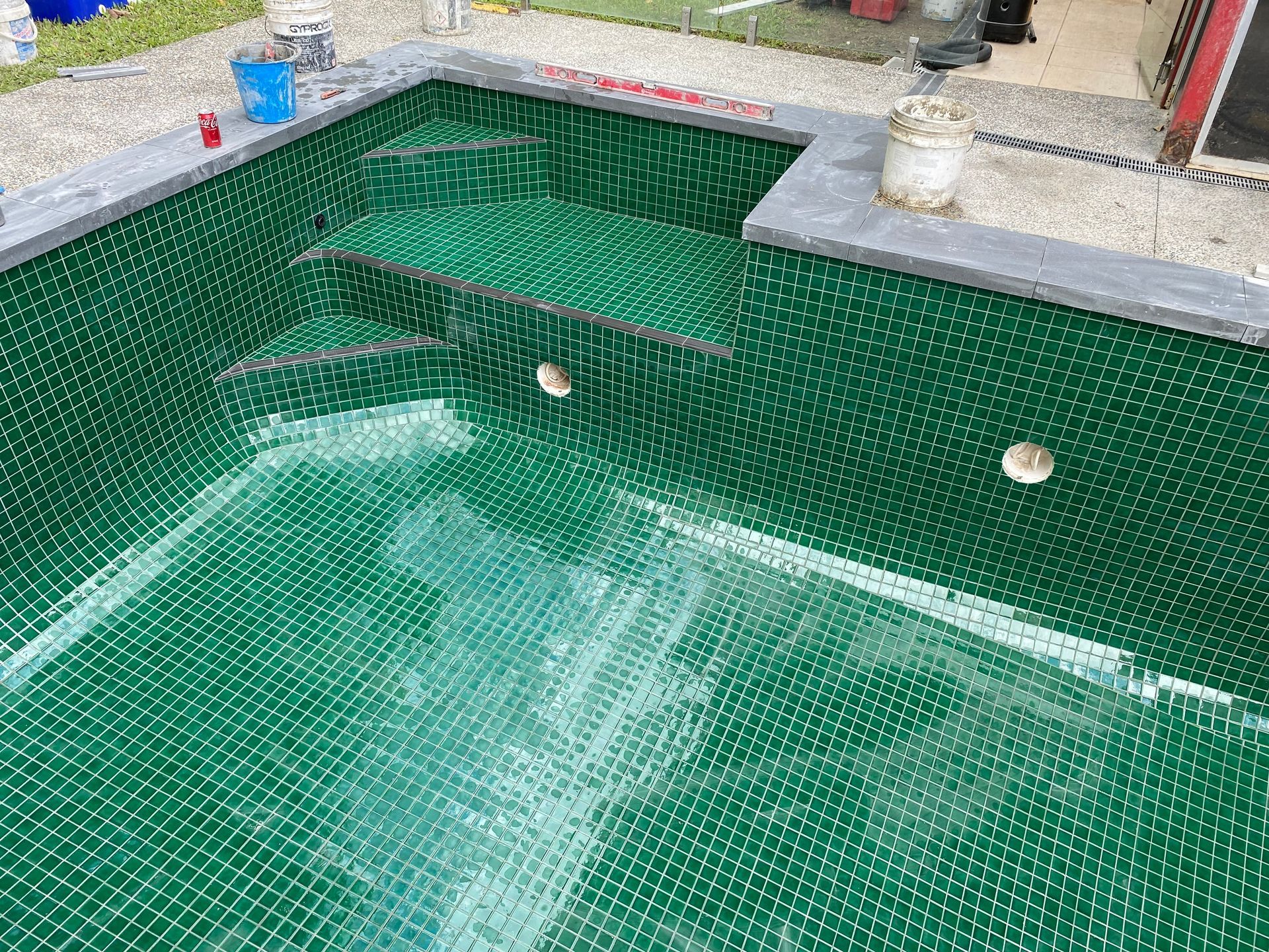 Pool interior under construction; green mesh lining walls and steps — Worrall Tiling in South Kempsey, NSW