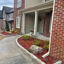 Walking Path to Home with concrete and stonework 