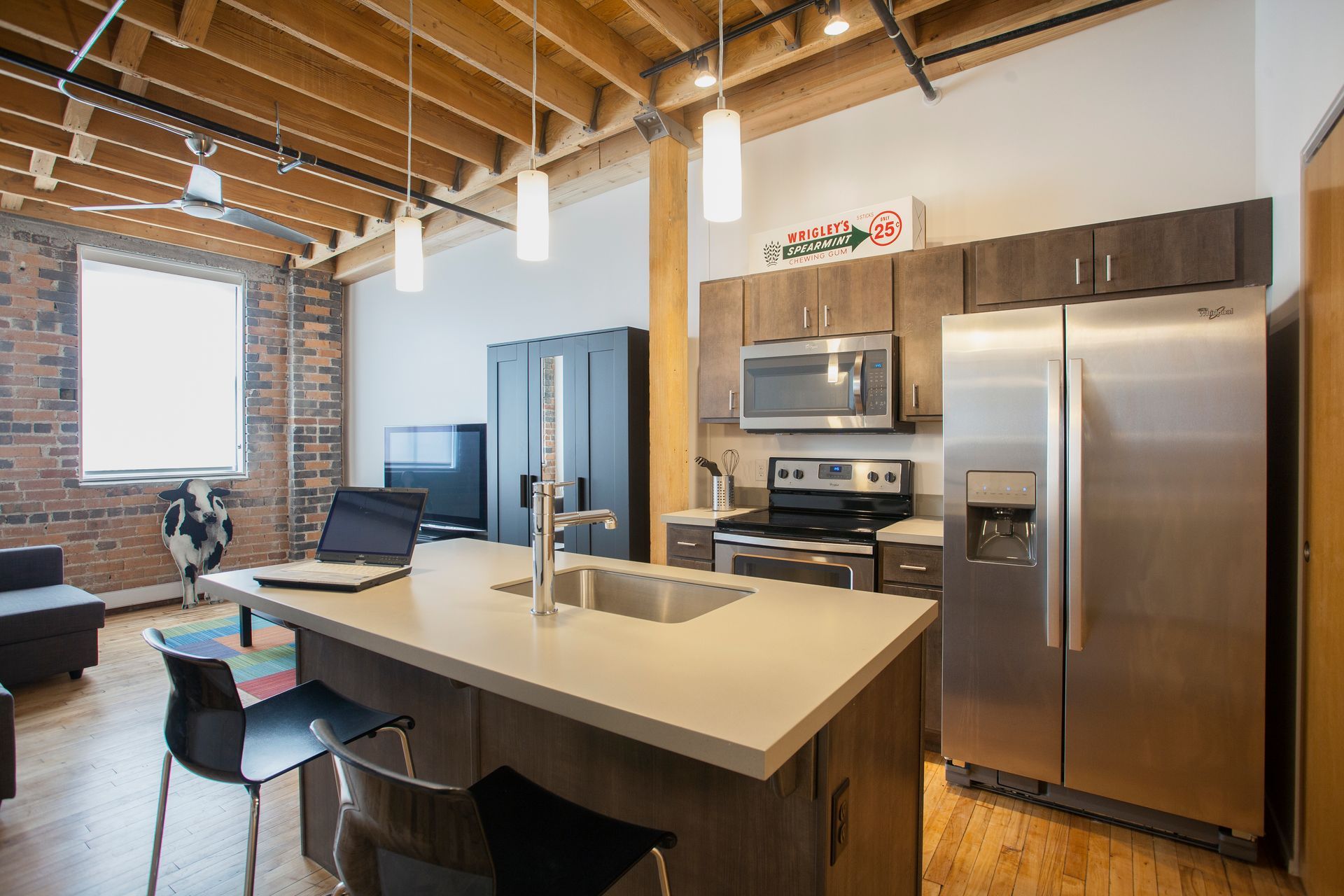 a kitchen with stainless steel appliances and a large island .
