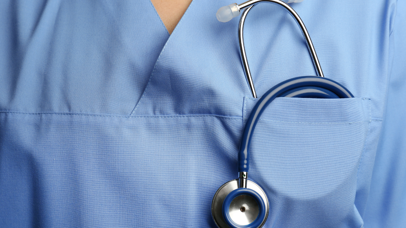 A close up of a stethoscope in a nurse 's pocket