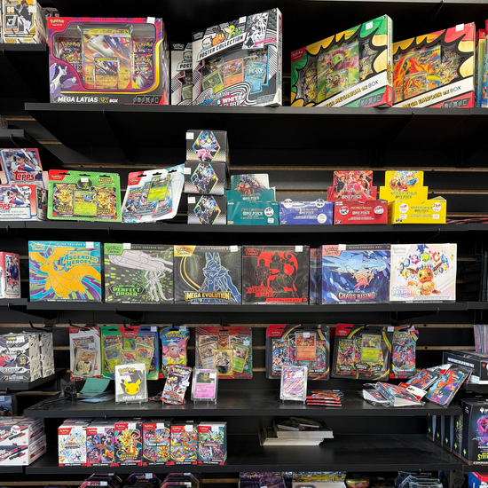 Shelves of colorful Pokémon trading card game boxes and booster packs in a store display