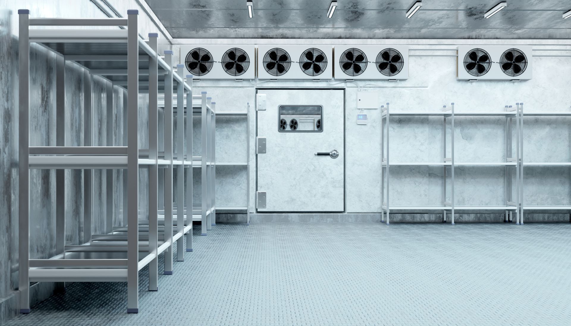 Empty industrial storage room with metal racks, white door, and cooling fans on the back wall