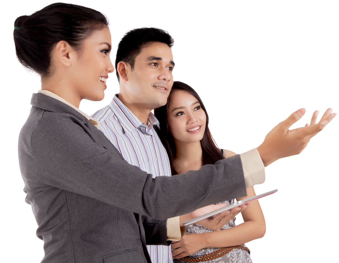 Three people in business attire smiling during a presentation, with one woman gesturing forward.