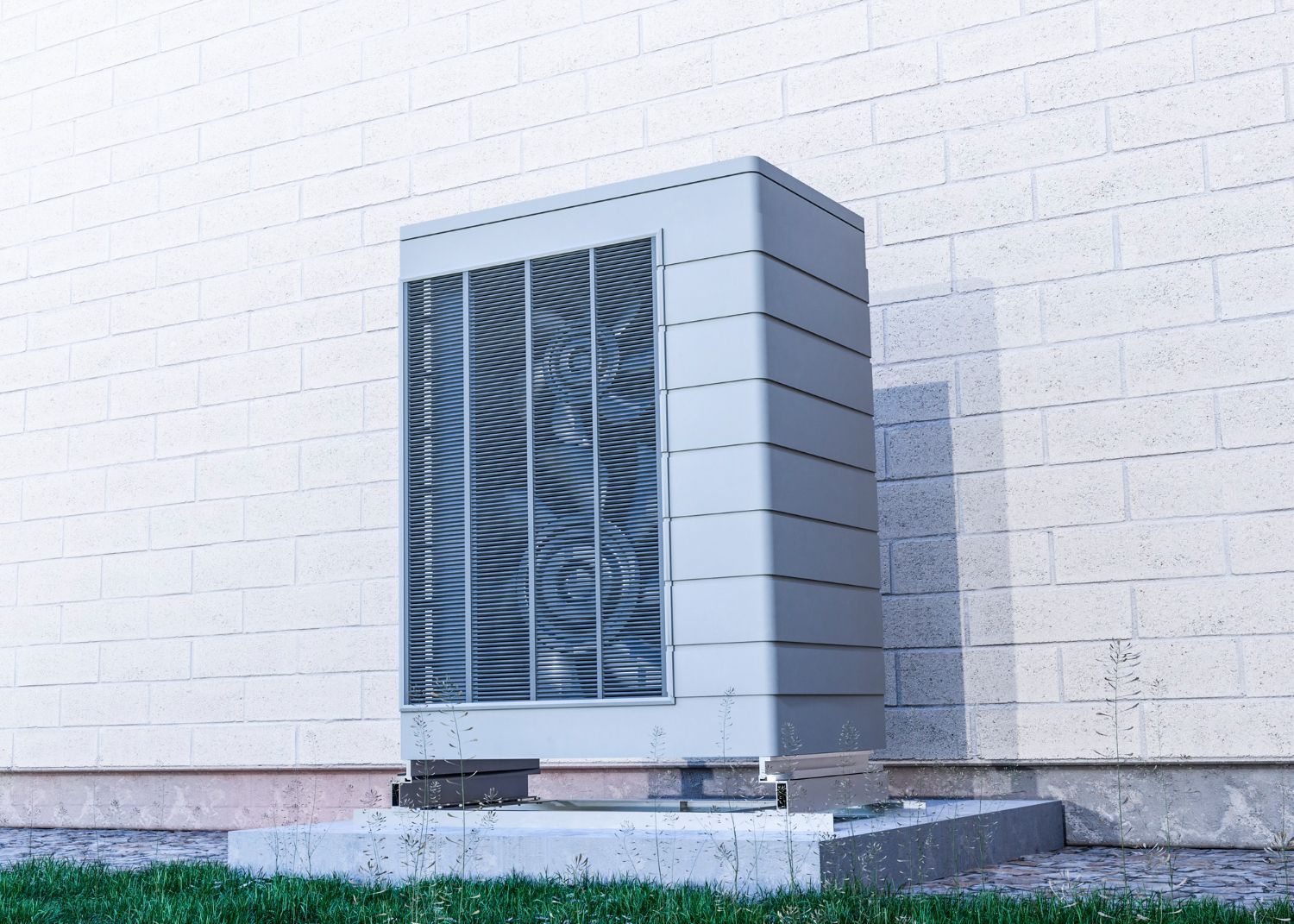 Outdoor HVAC unit beside a white brick wall on a concrete pad