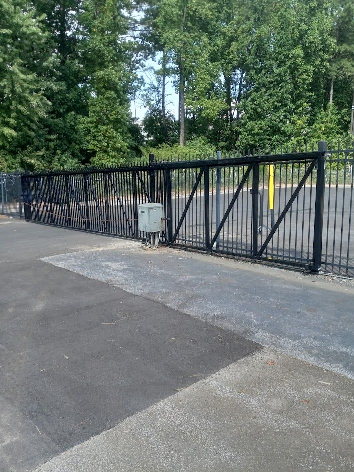 Commercial Gates, Cantilever, Single or Double Drive, Roll or Swing Gates. Security barbwire or classic style features with extended pickets that culminate to an arrow-pointed spear top with a breakaway feature. 
