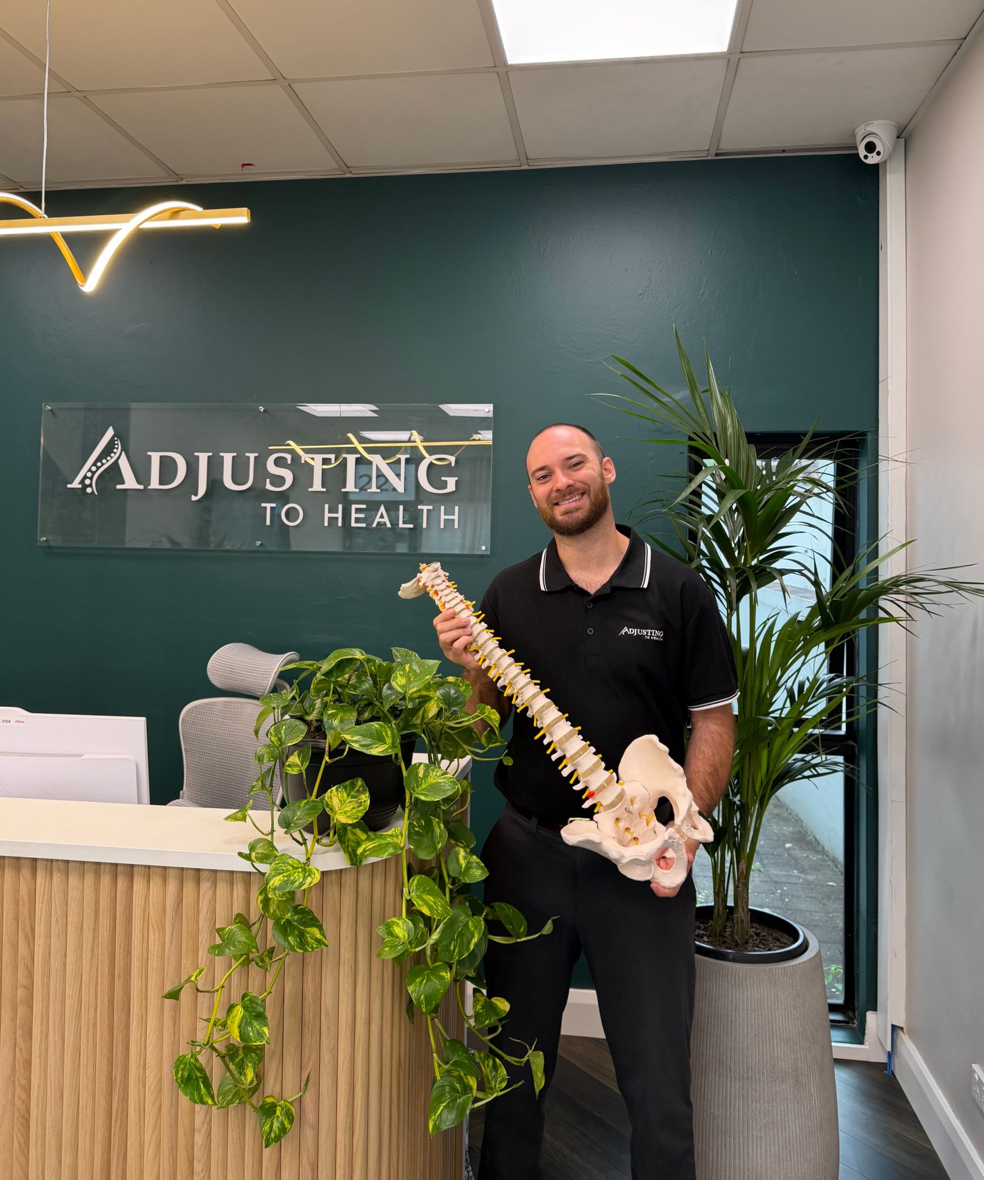 Dr-Sam-holding-spine