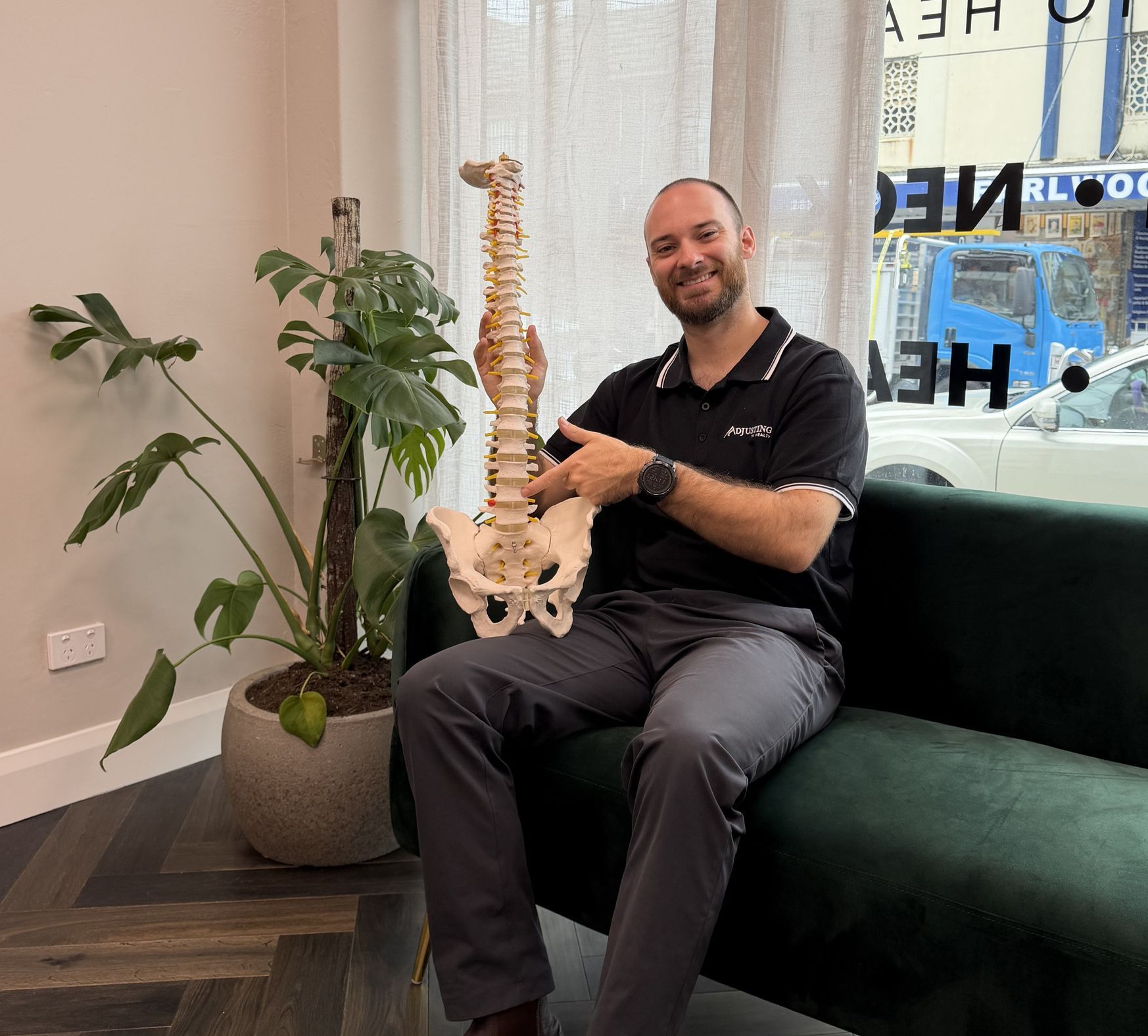 Dr-Sam-on-couch-with-spine