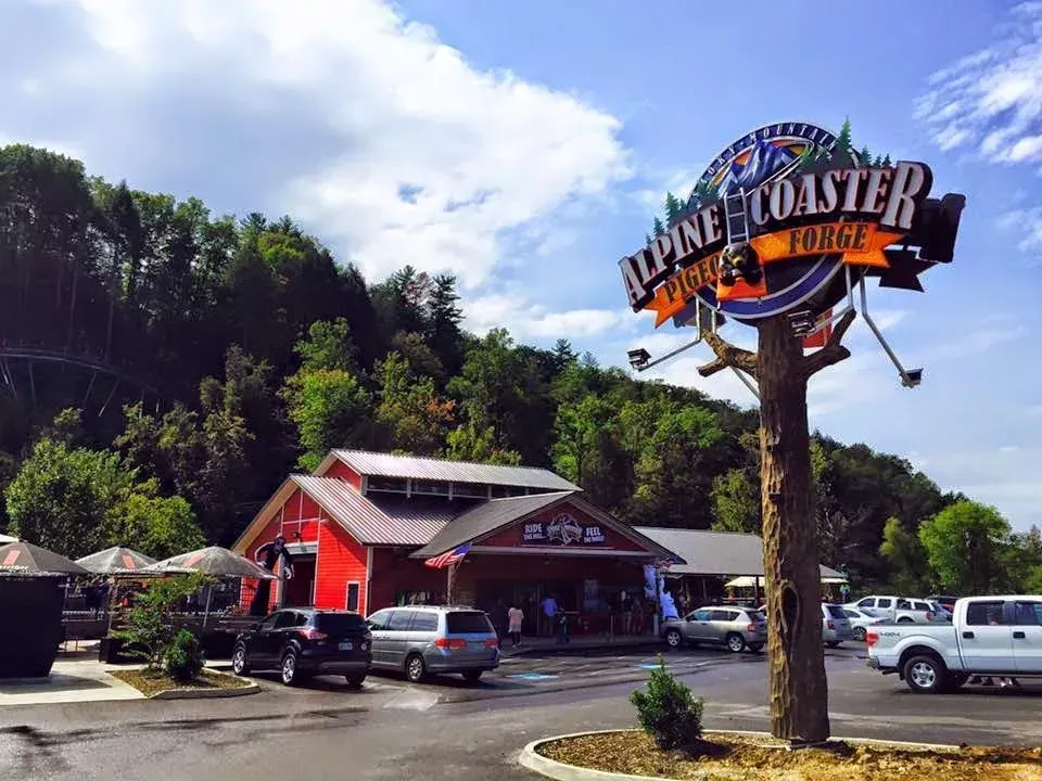 Red roadside building and parking lot beside a large “Bonefish” sign under a sunny blue sky