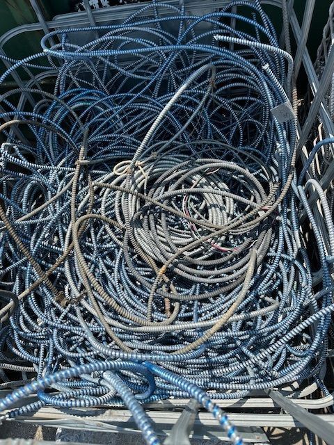 A pile of wire is sitting on top of a wooden crate.
