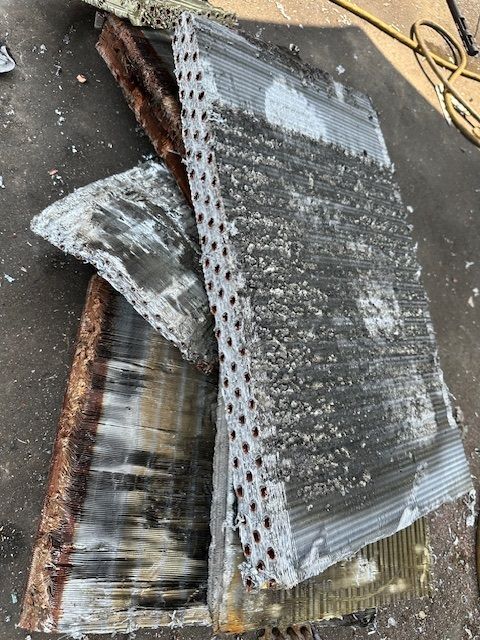 A pile of metal pieces sitting on top of each other on a table.