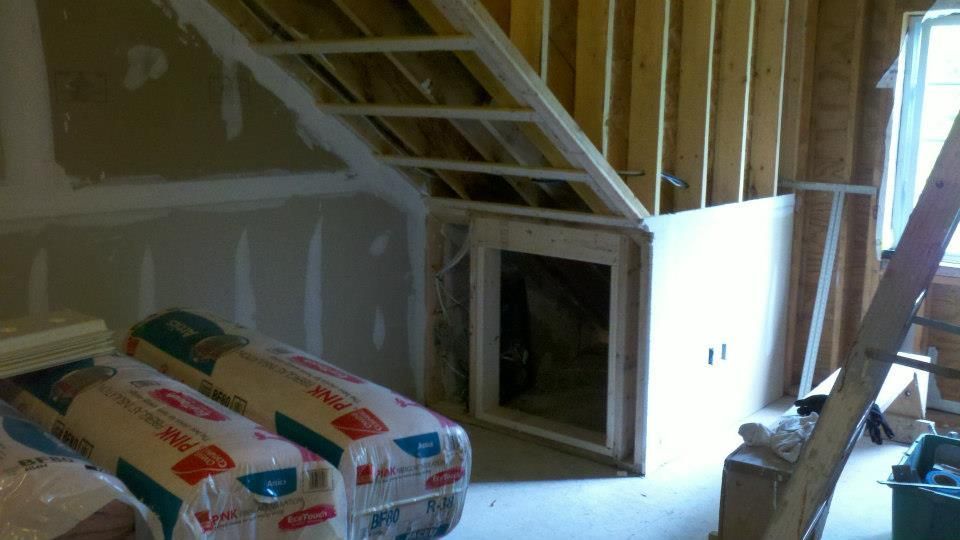 Plywood patch on a roof with a generator and box.